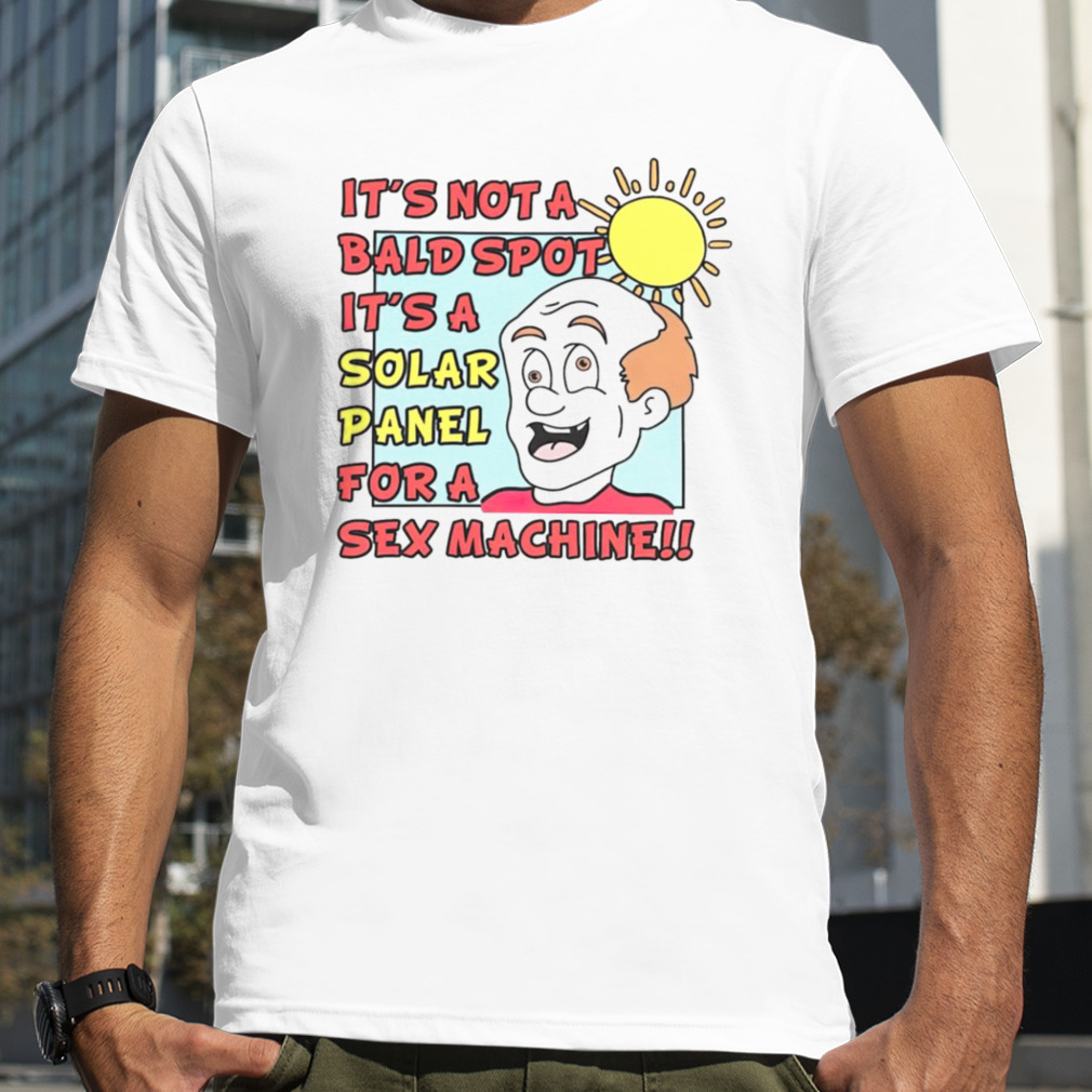 It’s not a bald spot it’s a solar panel for a Sex Machine T-shirt